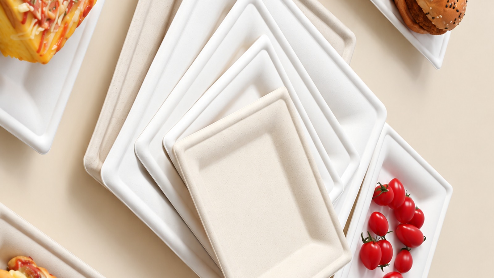 Square molded fiber plates with burgers, fried chicken, fries and cherry tomatoes